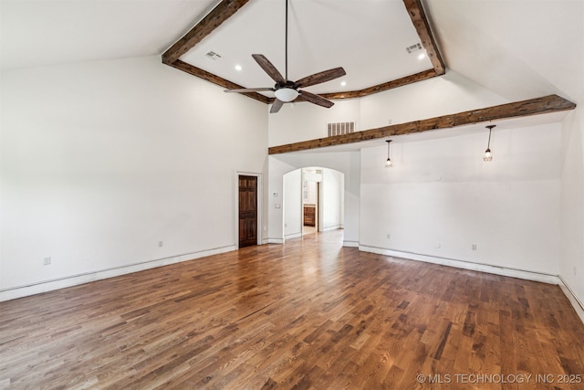 unfurnished living room featuring a ceiling fan, high vaulted ceiling, arched walkways, beamed ceiling, and wood finished floors