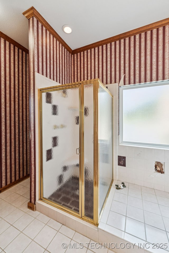 full bath featuring tile patterned flooring and a shower stall