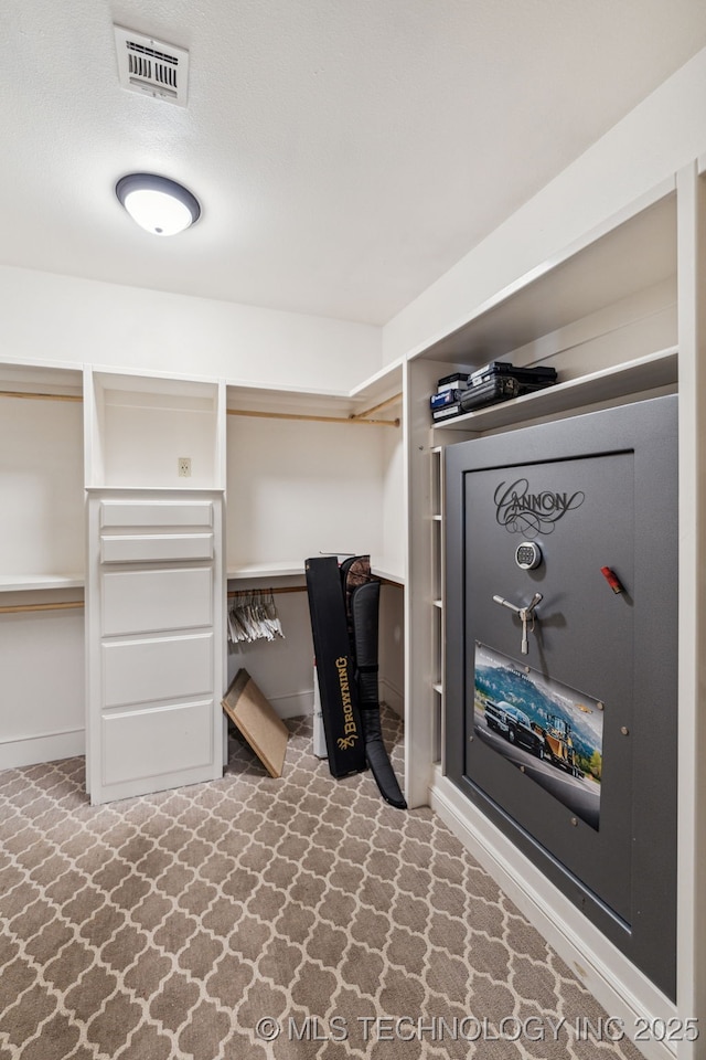 spacious closet with built in desk