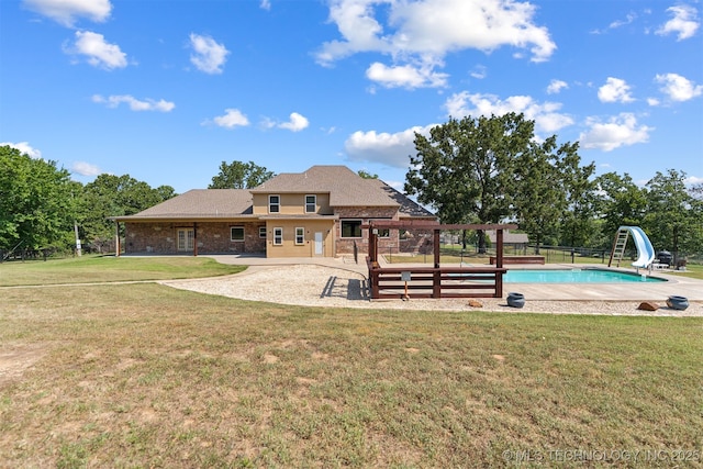 back of property featuring a patio area and brick siding