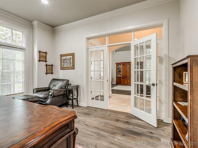 3661 S Lewis Ave, Tulsa, OK 74105 - home office with french doors, arched walkways, ornamental molding, and wood finished floors