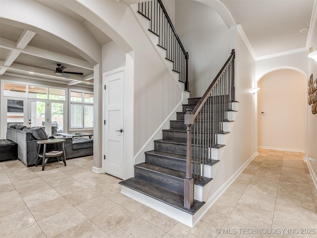 3661 S Lewis Ave, Tulsa, OK 74105 - staircase featuring a ceiling fan, ornamental molding, coffered ceiling, arched walkways, and tile patterned flooring