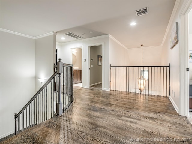 3661 S Lewis Ave, Tulsa, OK 74105 - corridor with an upstairs landing, wood finished floors, ornamental molding, recessed lighting, and baseboards