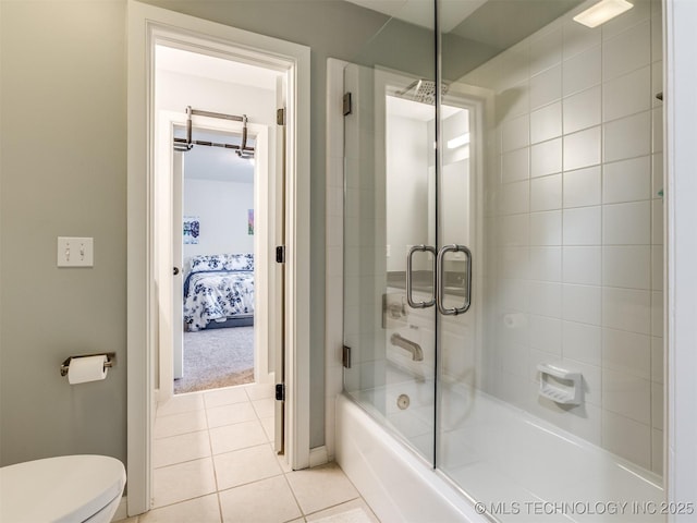 3661 S Lewis Ave, Tulsa, OK 74105 - ensuite bathroom featuring bath / shower combo with glass door and tile patterned floors