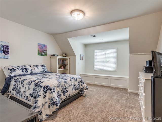 3661 S Lewis Ave, Tulsa, OK 74105 - bedroom featuring light colored carpet and vaulted ceiling