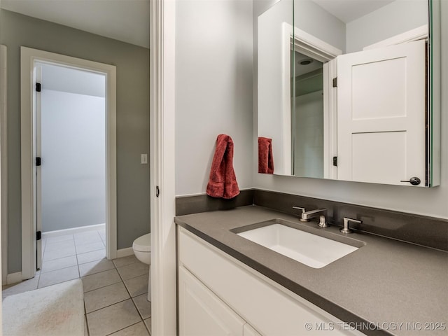 3661 S Lewis Ave, Tulsa, OK 74105 - bathroom featuring toilet, vanity, tile patterned flooring, and baseboards