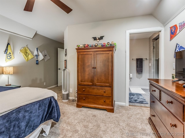 3661 S Lewis Ave, Tulsa, OK 74105 - bedroom with connected bathroom, light carpet, and baseboards