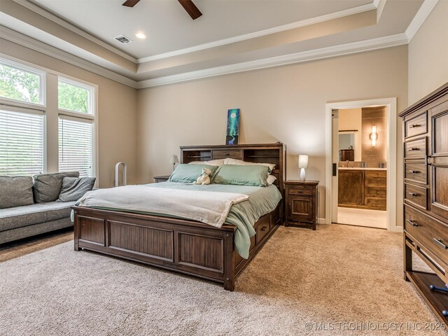 3661 S Lewis Ave, Tulsa, OK 74105 - bedroom with a raised ceiling, carpet flooring, ornamental molding, connected bathroom, and a ceiling fan