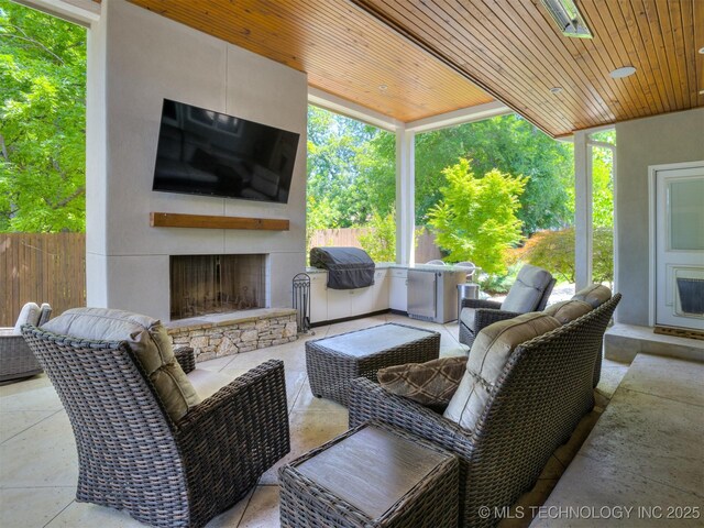 3661 S Lewis Ave, Tulsa, OK 74105 - view of patio with an outdoor living space with a fireplace and a grill
