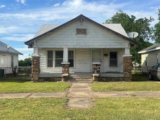907 E 3rd St, Okmulgee, OK 74447 - view of front of property with covered porch and roof with shingles
