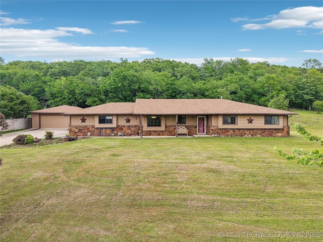 ranch-style home featuring stone siding, a front yard, a wooded view, driveway, and a porch