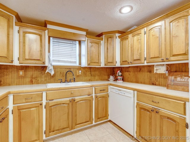 kitchen with dishwasher, a sink, light countertops, and a textured ceiling