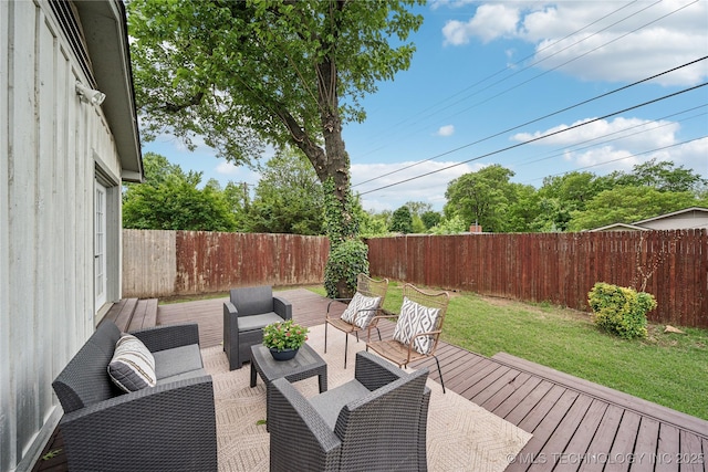 wooden deck with an outdoor living space