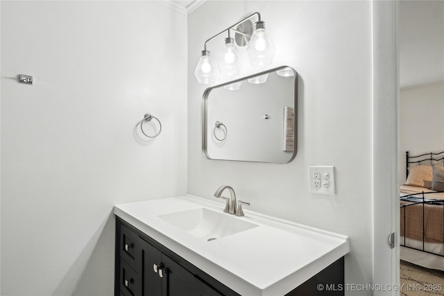 bathroom with vanity, ensuite bathroom, and crown molding