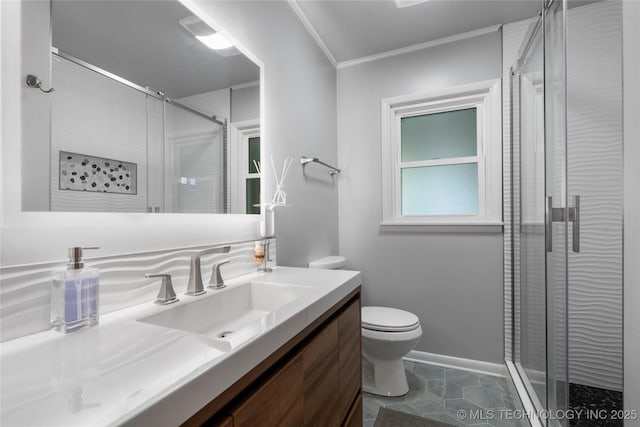 full bathroom with a shower stall, toilet, vanity, ornamental molding, and baseboards