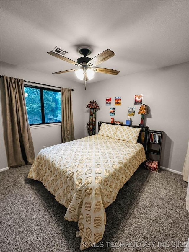 bedroom with carpet floors, ceiling fan, and baseboards
