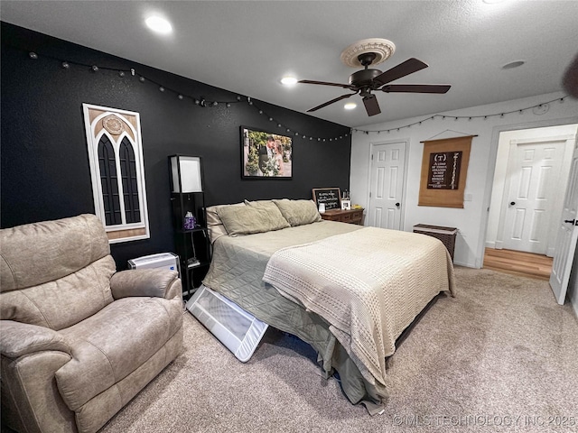 bedroom with light carpet, recessed lighting, and ceiling fan