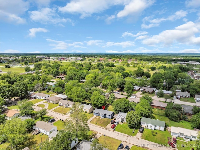 aerial perspective of suburban area with a tree filled landscape