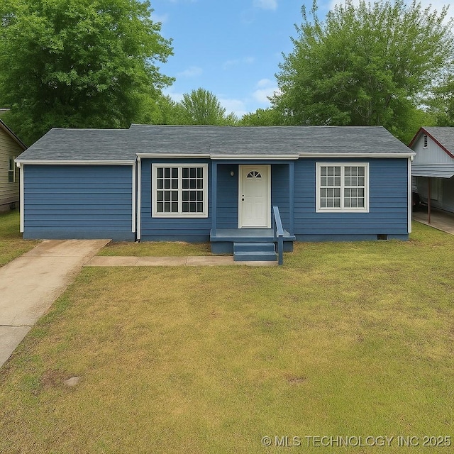 ranch-style home featuring a front yard and driveway