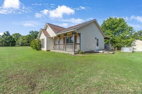 10718 W 162nd St, Skiatook, OK 74070 - rear view of property featuring a yard and a porch