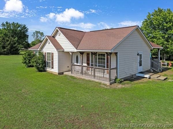 10718 W 162nd St, Skiatook, OK 74070 - rear view of property with a yard, a porch, and a shingled roof