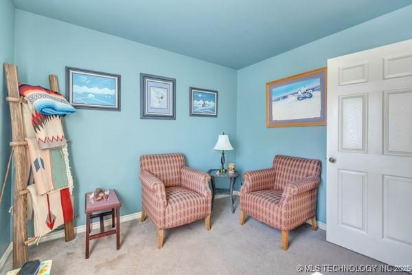 10718 W 162nd St, Skiatook, OK 74070 - living area with carpet floors and baseboards