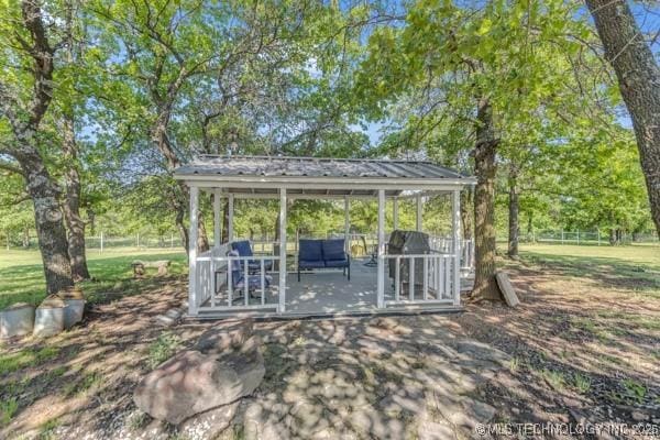 10718 W 162nd St, Skiatook, OK 74070 - view of patio / terrace with a gazebo, view of scattered trees, and fence