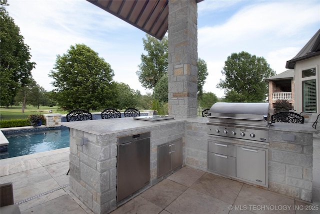 view of patio featuring grilling area, area for grilling, and an outdoor pool