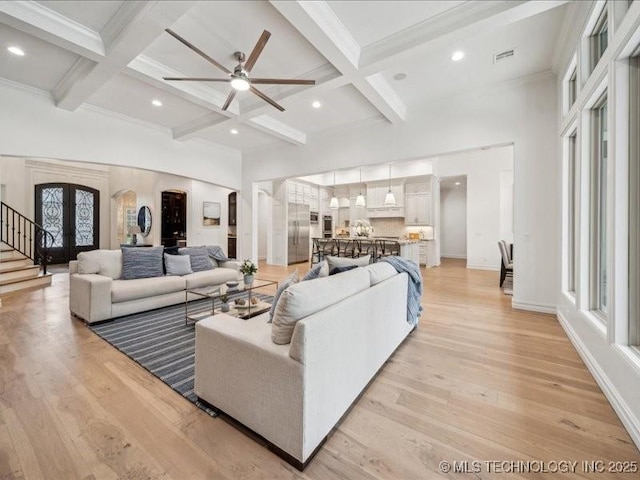 4301 S Mimosa Ave, Broken Arrow, OK 74011 - living room with a ceiling fan, beamed ceiling, arched walkways, coffered ceiling, and light wood-type flooring