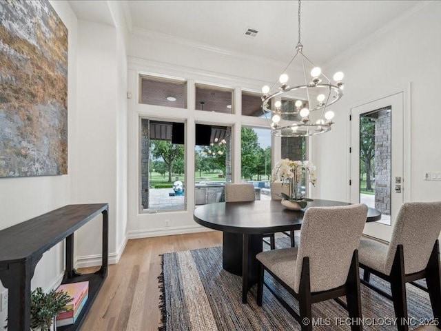 4301 S Mimosa Ave, Broken Arrow, OK 74011 - dining area featuring a chandelier, wood finished floors, ornamental molding, and baseboards