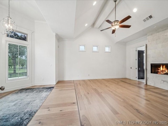 4301 S Mimosa Ave, Broken Arrow, OK 74011 - unfurnished living room with light wood-style flooring, beam ceiling, a chandelier, a premium fireplace, and a ceiling fan
