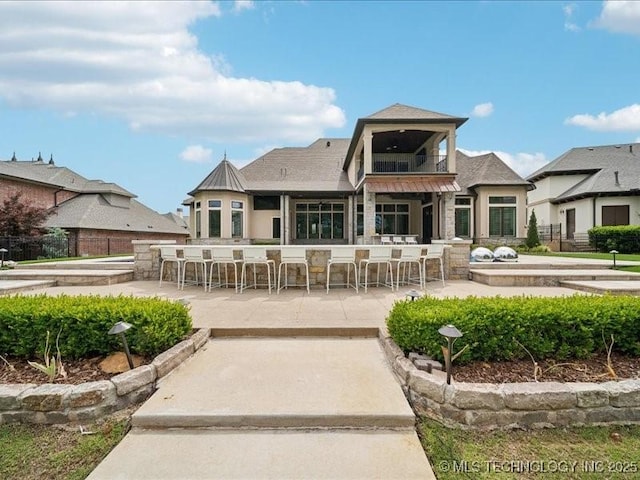 4301 S Mimosa Ave, Broken Arrow, OK 74011 - back of property with a balcony and a patio