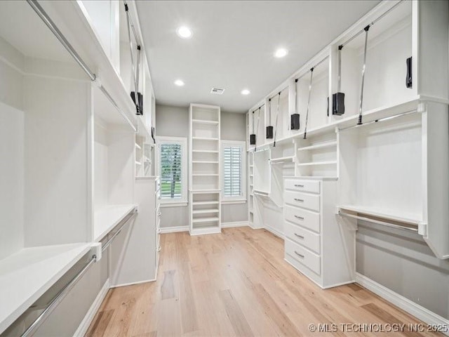 4301 S Mimosa Ave, Broken Arrow, OK 74011 - walk in closet with light wood-style flooring
