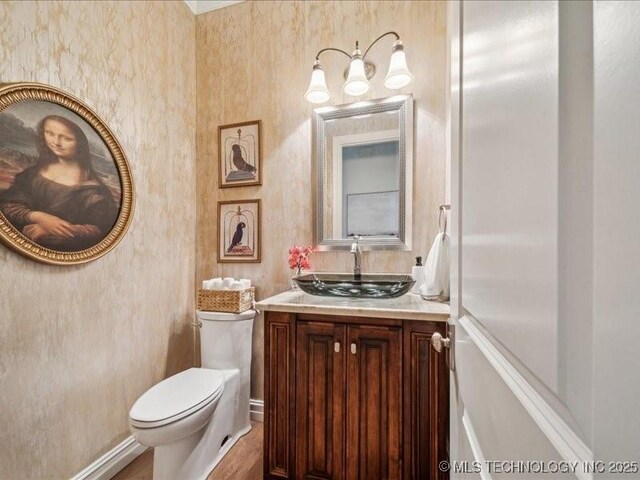 4301 S Mimosa Ave, Broken Arrow, OK 74011 - bathroom featuring toilet, vanity, and wood finished floors