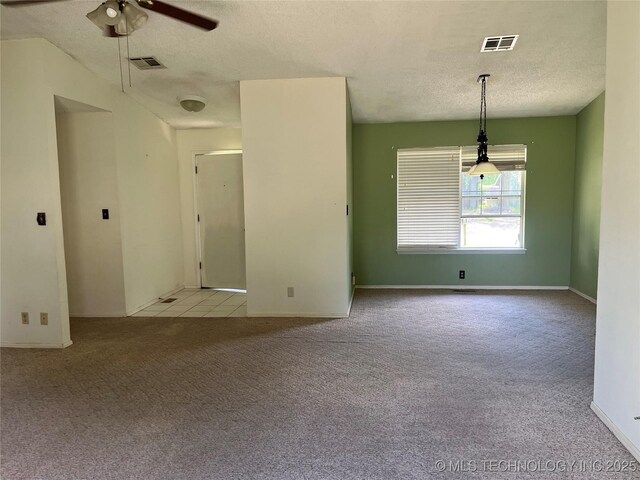 14139 E 26th St, Tulsa, OK 74134 - unfurnished room with a textured ceiling, carpet, ceiling fan, and baseboards