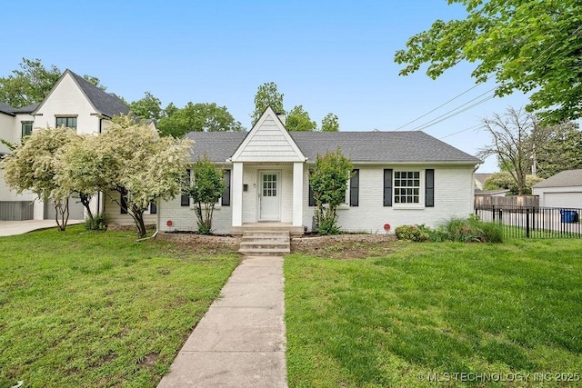 view of front of home featuring brick siding and a shingled roof