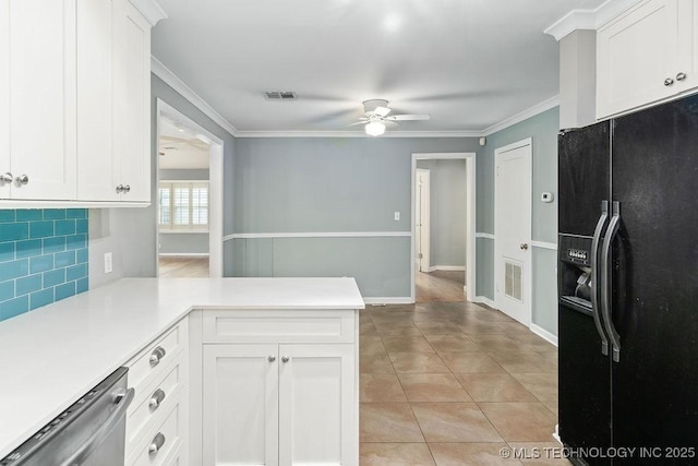 kitchen featuring black fridge, a ceiling fan, a peninsula, light countertops, and backsplash