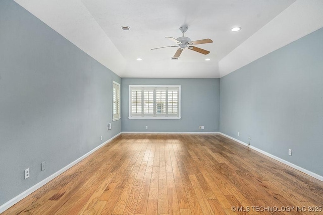 empty room with a ceiling fan, light wood-style flooring, baseboards, and recessed lighting