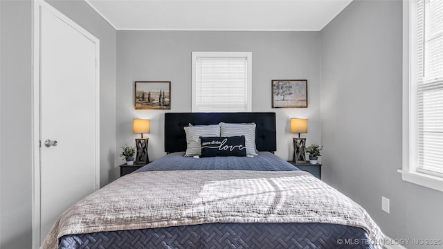 bedroom with crown molding