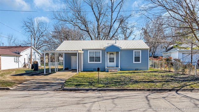 view of front of home featuring driveway, metal roof, a carport, and entry steps