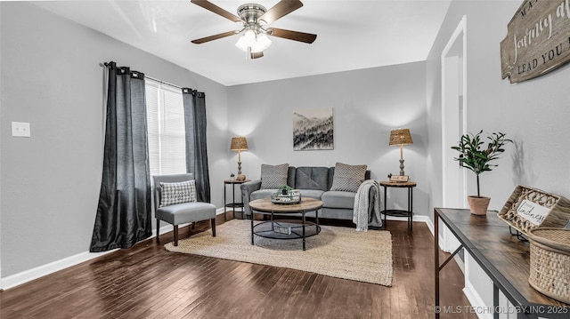 living room featuring wood finished floors, ceiling fan, and baseboards
