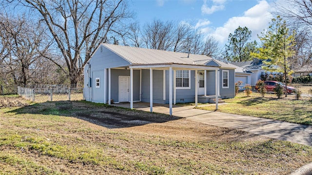 ranch-style house featuring a porch, driveway, metal roof, and crawl space