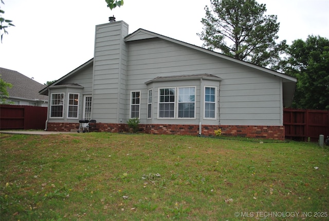 9908 S 95th E Ave, Broken Arrow, OK 74133 - rear view of property featuring a chimney