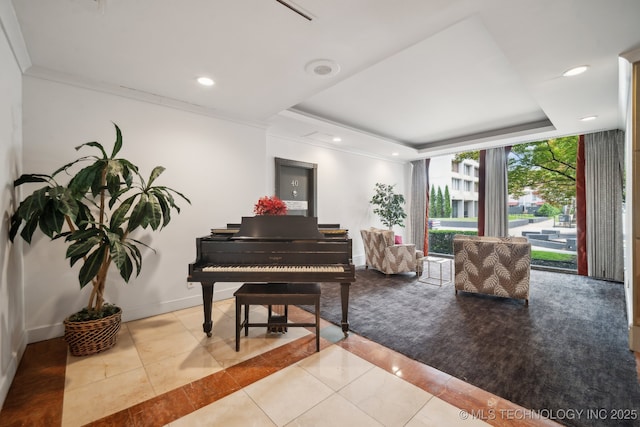 sitting room featuring a raised ceiling, tile patterned floors, baseboards, recessed lighting, and crown molding