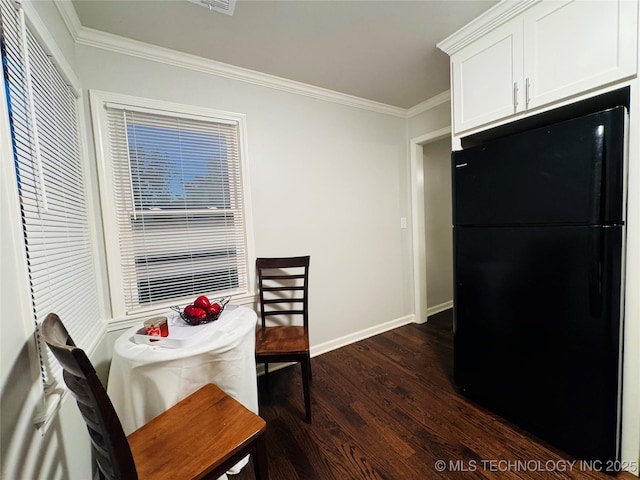 3922 S Norfolk Ave, Tulsa, OK 74105 - dining space featuring dark wood-style flooring, ornamental molding, and baseboards