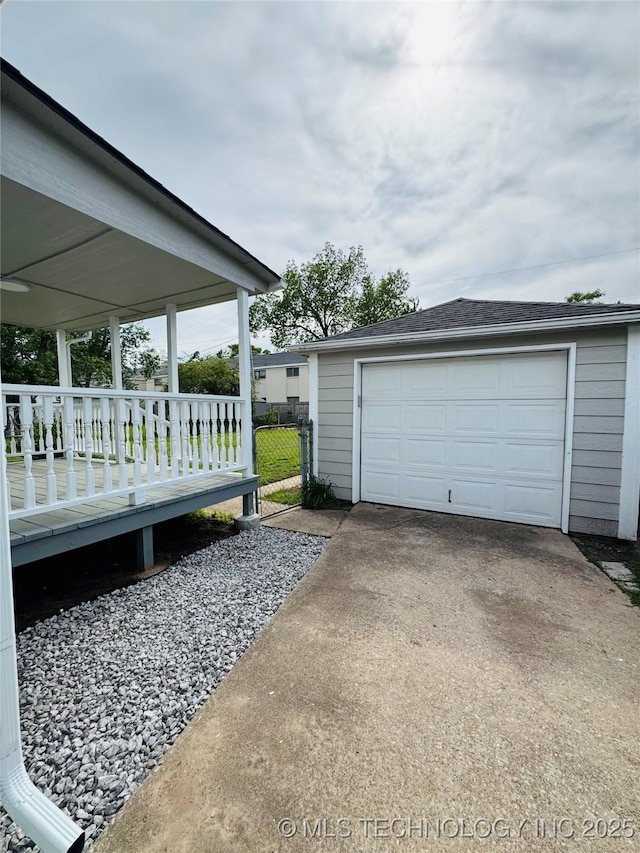 3922 S Norfolk Ave, Tulsa, OK 74105 - view of home's exterior featuring driveway, an outdoor structure, and a garage