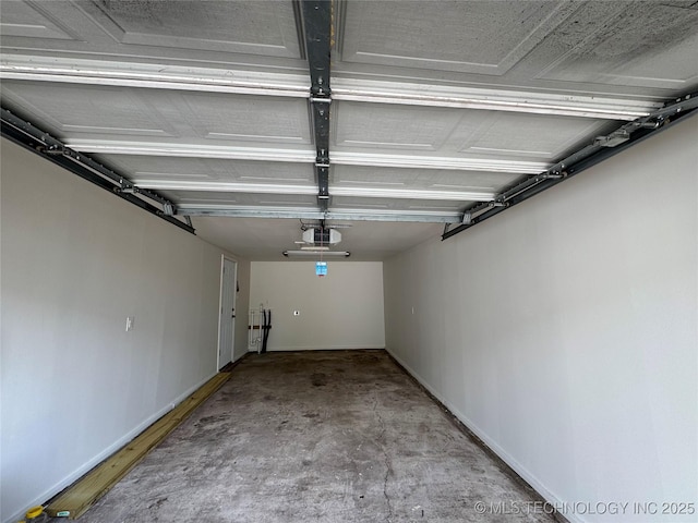 3922 S Norfolk Ave, Tulsa, OK 74105 - garage with a garage door opener and baseboards