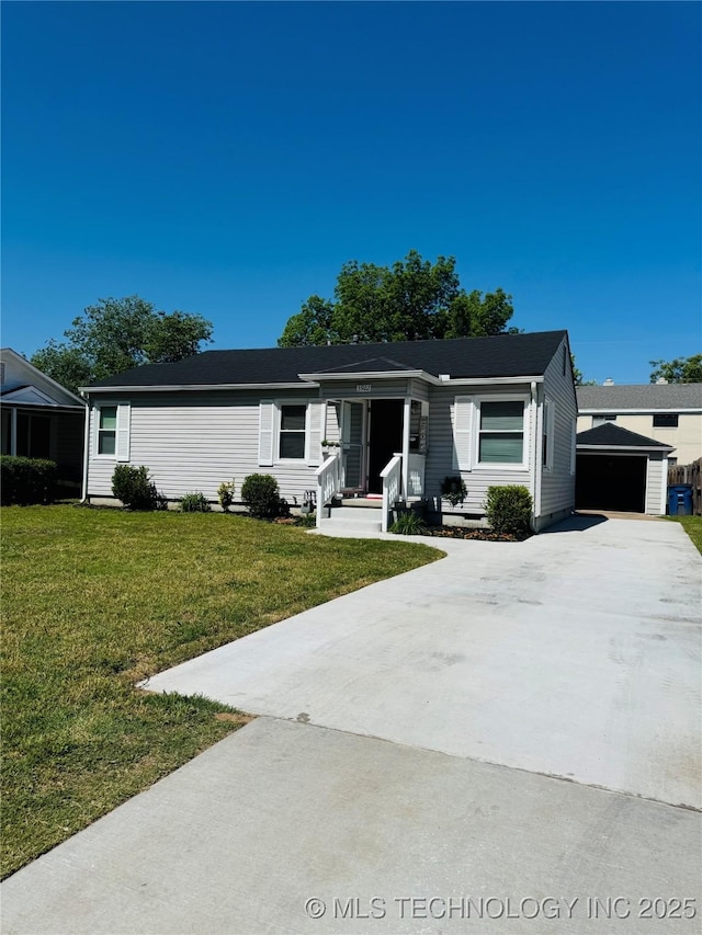 3922 S Norfolk Ave, Tulsa, OK 74105 - ranch-style home featuring an outbuilding, a front lawn, and a detached garage