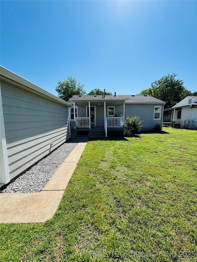 3922 S Norfolk Ave, Tulsa, OK 74105 - view of front facade with a porch and a front lawn