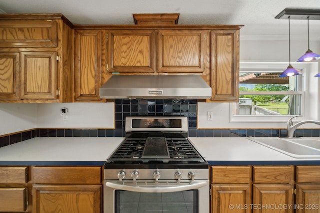 11462 Red Fox Ln, Sperry, OK 74073 - kitchen featuring gas stove, ventilation hood, a sink, brown cabinets, and crown molding
